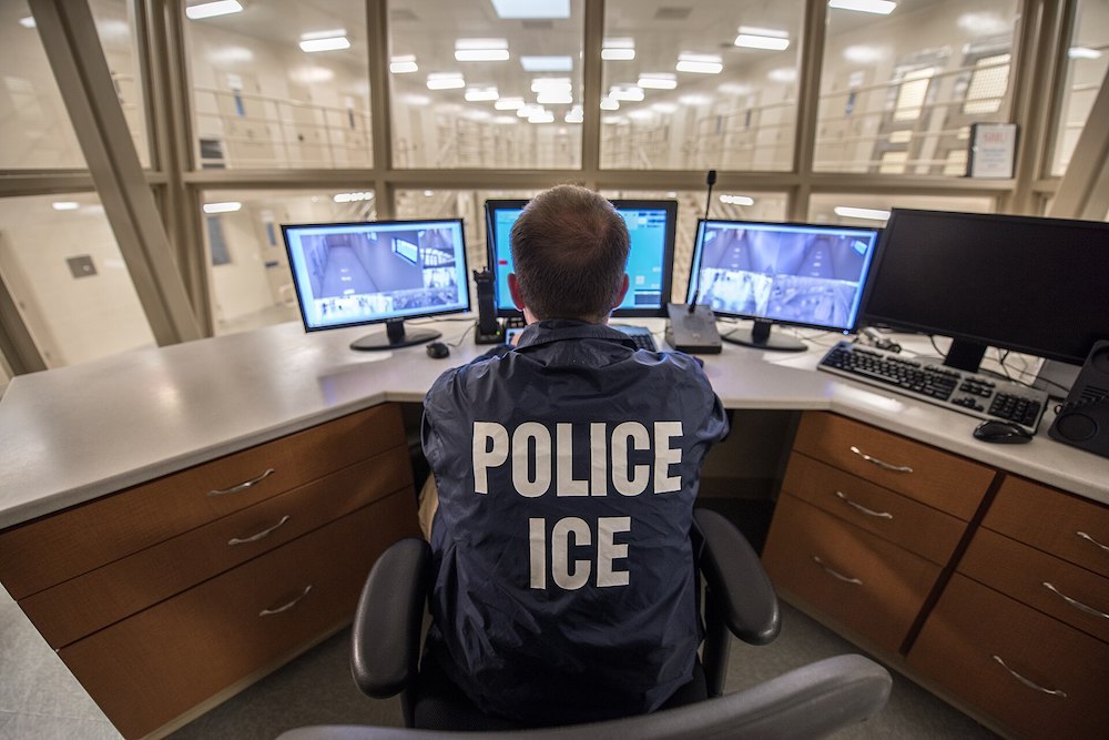 An ICE officer monitors a detention facility in Buffalo, New York.