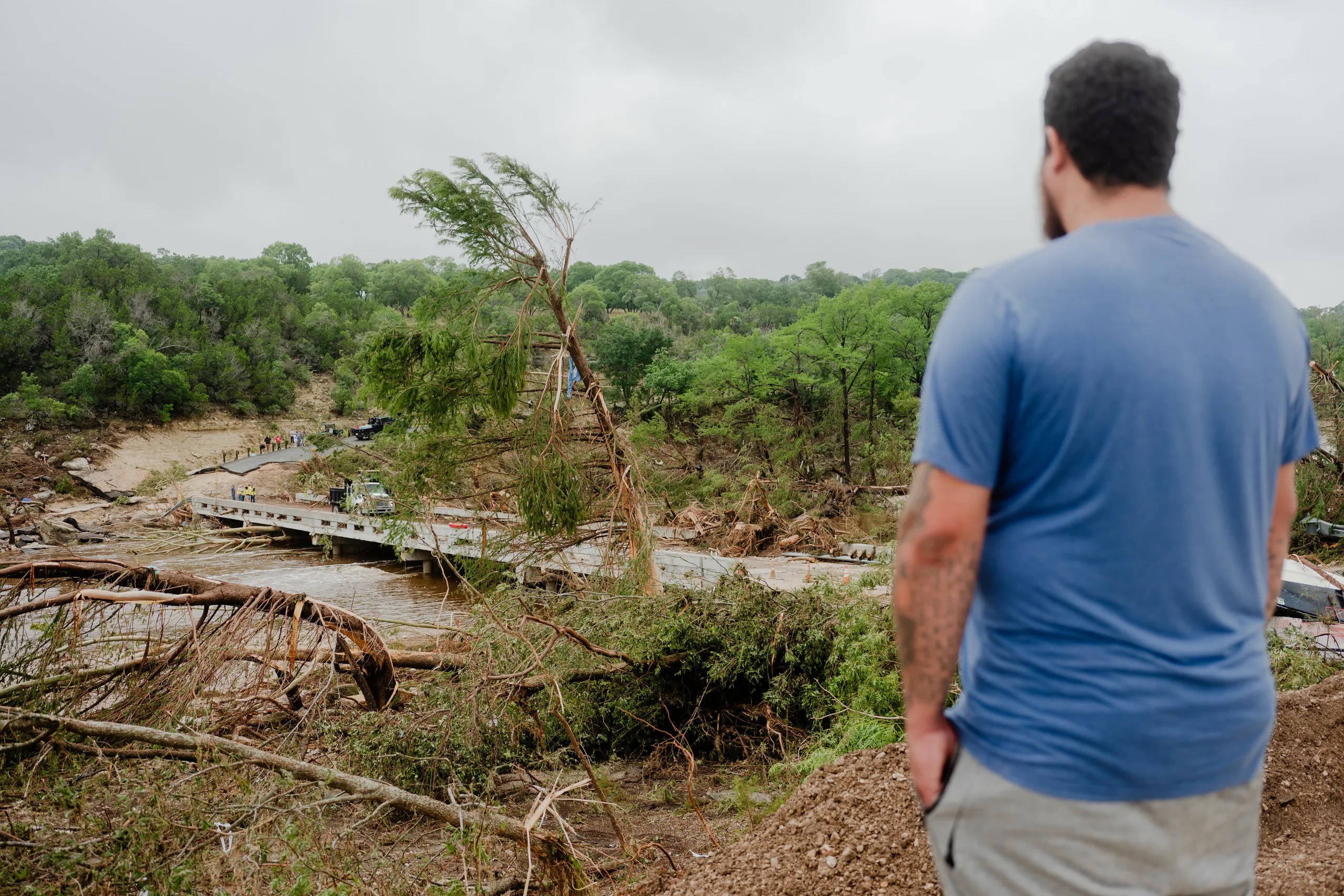 A man stares at damage caused by the Fourth of July flood in Ingram on July 5, 2025.