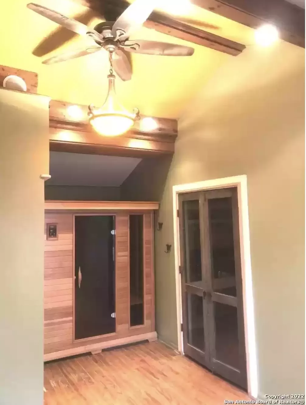 State Rep. Brooks Landgraf, R-Odessa, speaks with Rep. Tom Oliverson, R-Cypress, on the House floor in Austin on July 24, 2025.