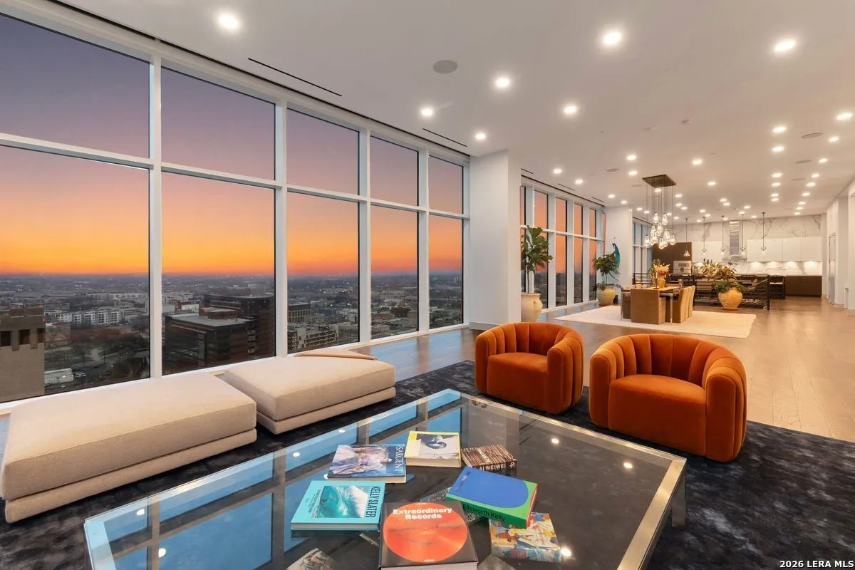 A 2-story San Antonio penthouse on the market has skyline views, a pool desk and its personal cinema