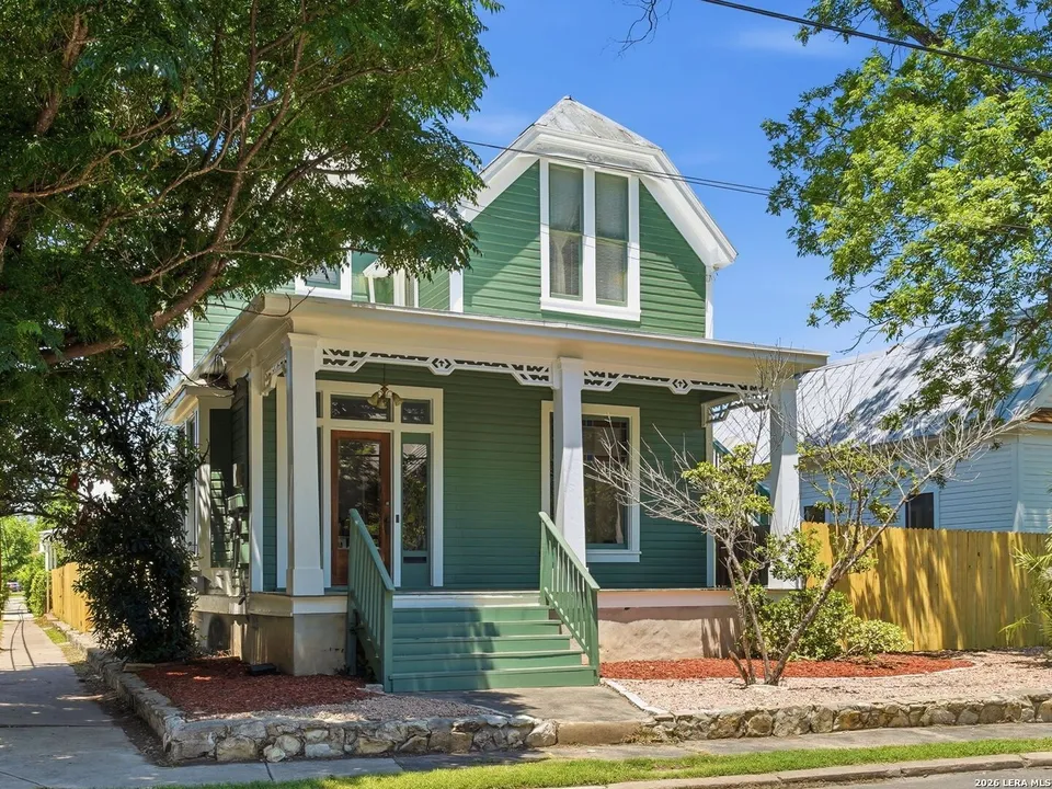 Queen Anne Victorian for sale steps from the River Walk has a sun porch and stained glass windows