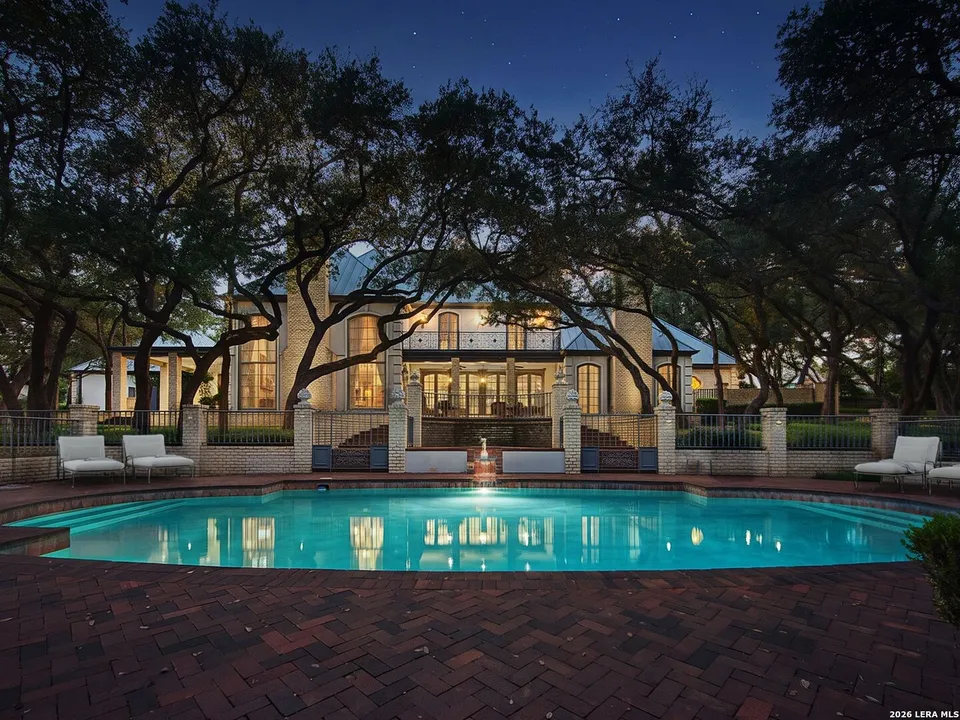 A French-style mansion for sale in San Antonio comes with a tennis court, a sauna and its own private lake